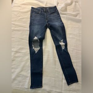 American Eagle stretch skinny jeggings with ripped knees. Size 2 regular.